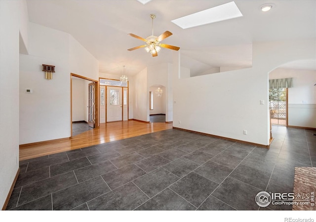 spare room featuring ceiling fan, dark hardwood / wood-style flooring, and lofted ceiling