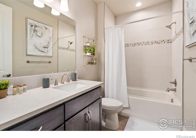 full bathroom featuring toilet, tile patterned floors, vanity, and shower / tub combo with curtain