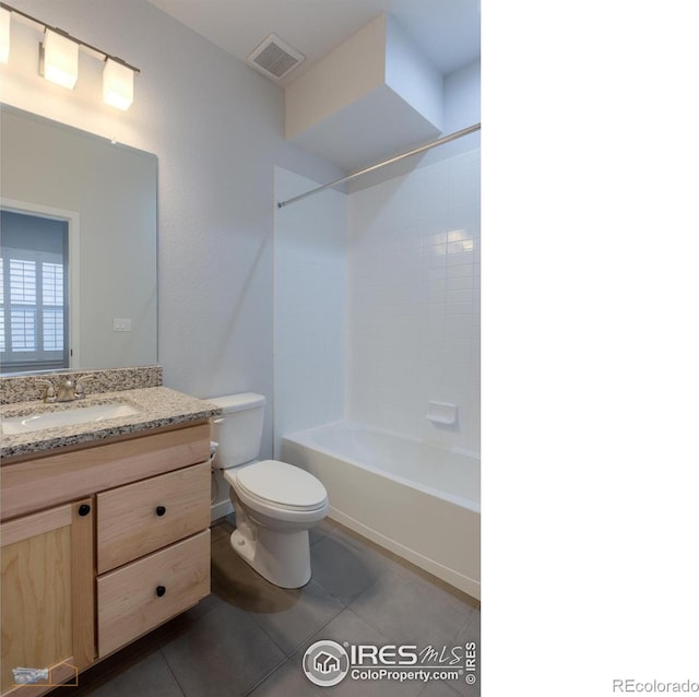 full bathroom with shower / washtub combination, tile patterned flooring, vanity, and toilet