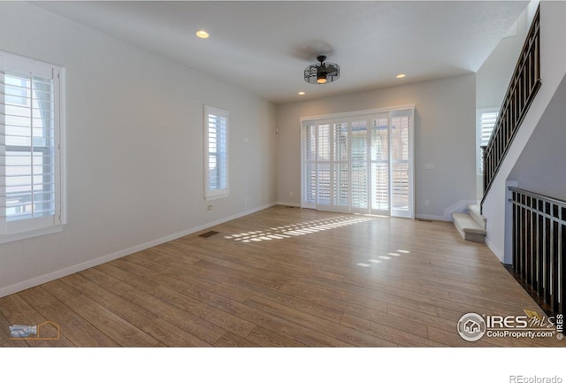 spare room with light hardwood / wood-style floors