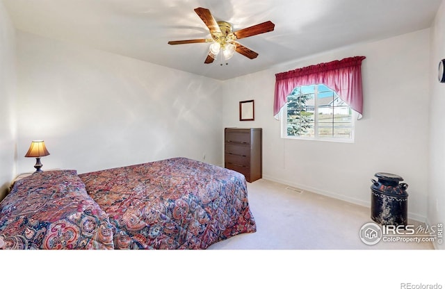 carpeted bedroom with ceiling fan