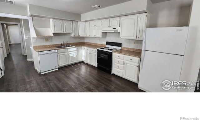 kitchen with dark hardwood / wood-style floors, white cabinetry, sink, and white appliances