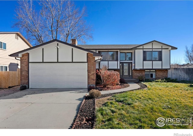 view of front facade featuring a garage and a front yard