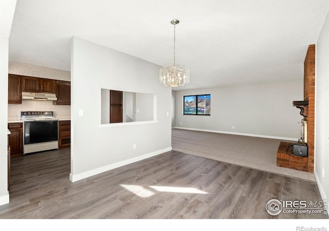 interior space with light hardwood / wood-style floors and an inviting chandelier