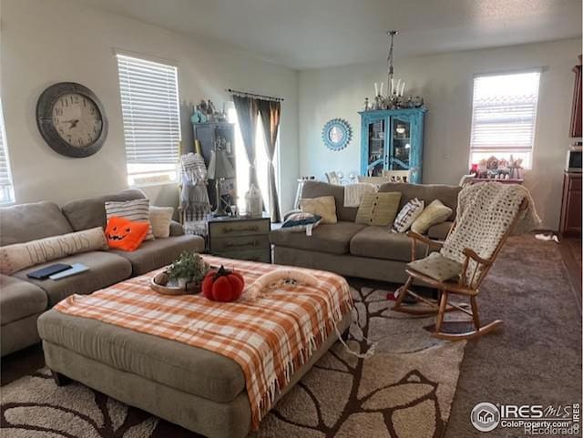 living room featuring a notable chandelier