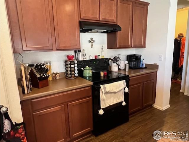 kitchen with black / electric stove and dark wood-type flooring