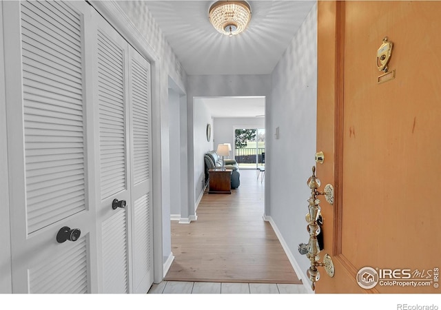 hallway featuring light hardwood / wood-style flooring