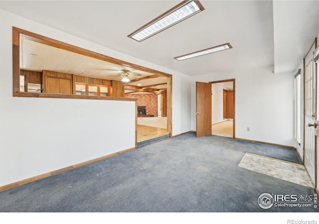 carpeted empty room featuring ceiling fan