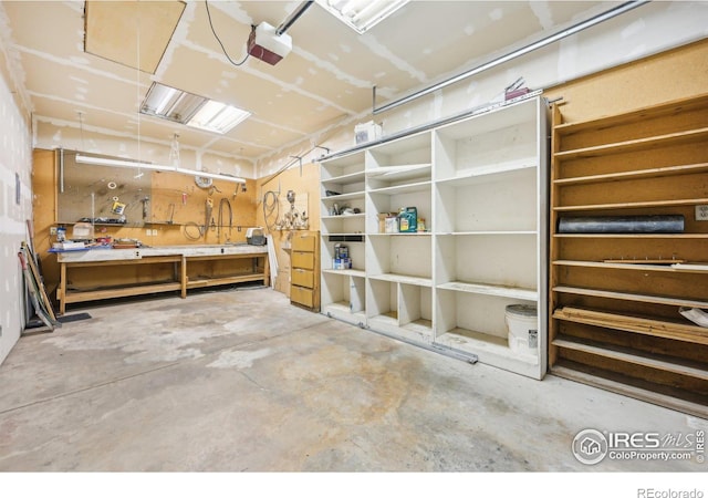 miscellaneous room featuring a workshop area and concrete flooring