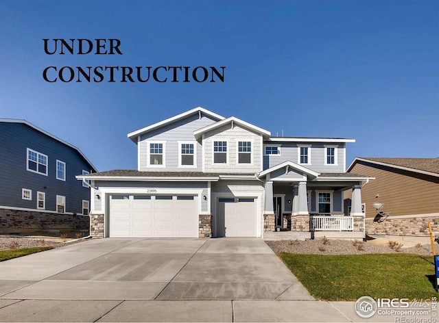 craftsman inspired home featuring a porch and a garage