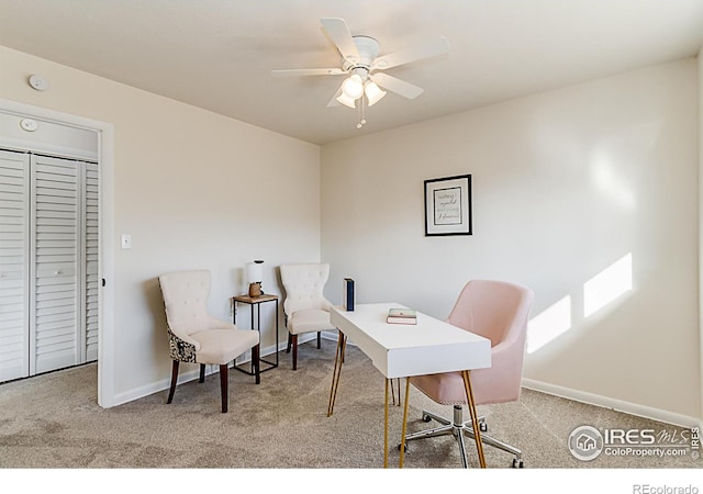 office with ceiling fan, baseboards, and light colored carpet