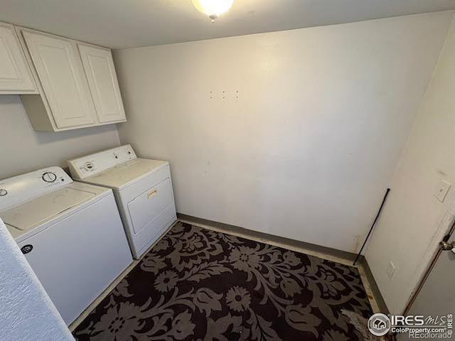 laundry area with cabinets and washer and clothes dryer