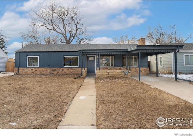 single story home featuring a carport