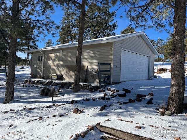 view of snow covered garage