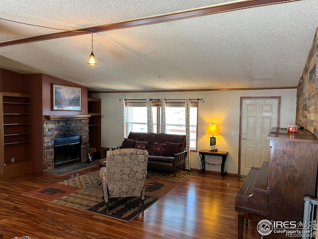 living room with a stone fireplace, dark hardwood / wood-style flooring, and a textured ceiling