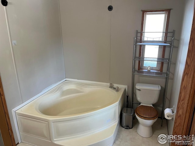 bathroom featuring a bathing tub and toilet