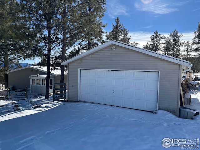 view of snow covered garage