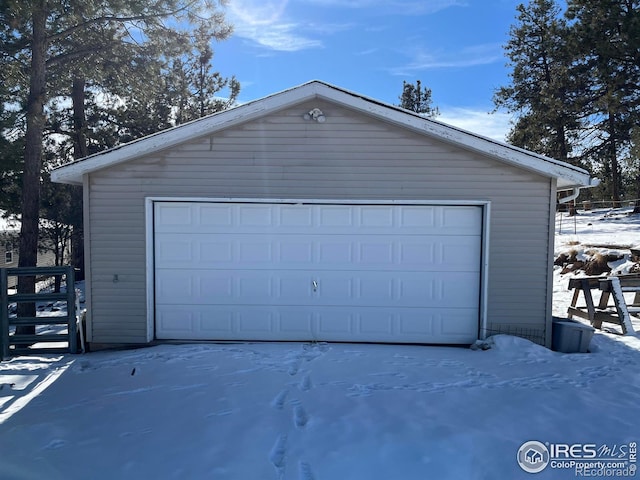 view of snow covered garage