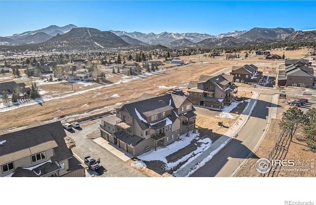 drone / aerial view featuring a mountain view