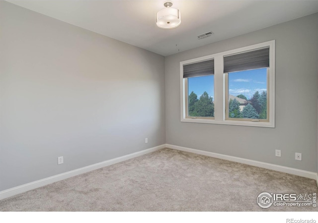 view of carpeted spare room