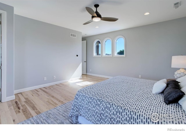 bedroom featuring ceiling fan and light hardwood / wood-style floors