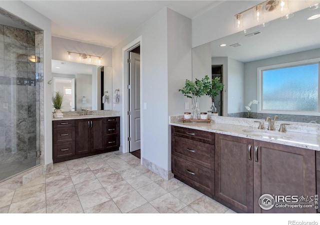 bathroom featuring vanity and walk in shower