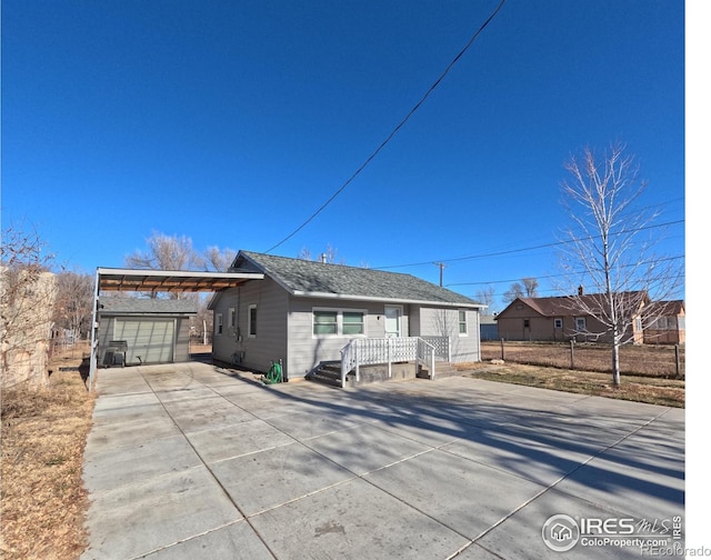 view of front of house with an outbuilding and a garage