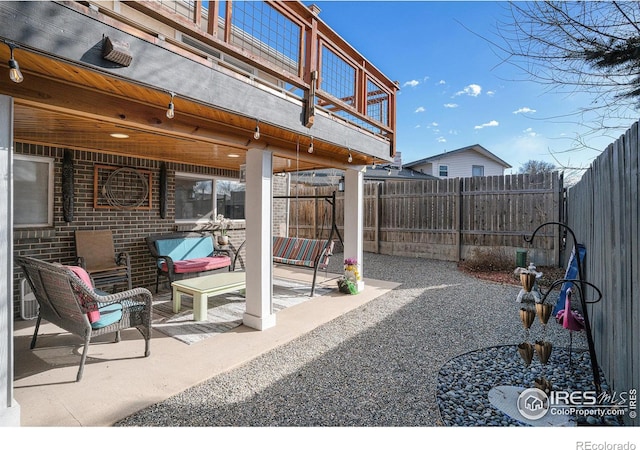 view of patio featuring a balcony