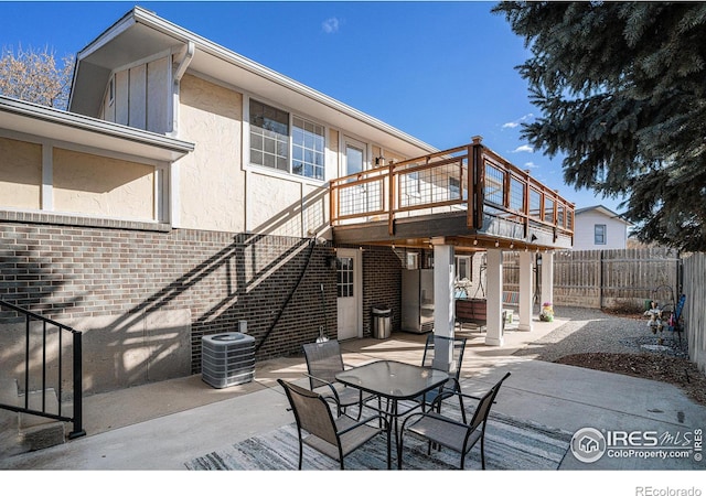 view of patio featuring a deck and central AC unit