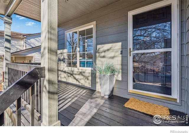 property entrance with covered porch