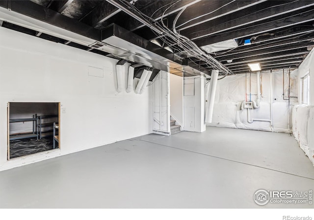 unfinished basement with stairway