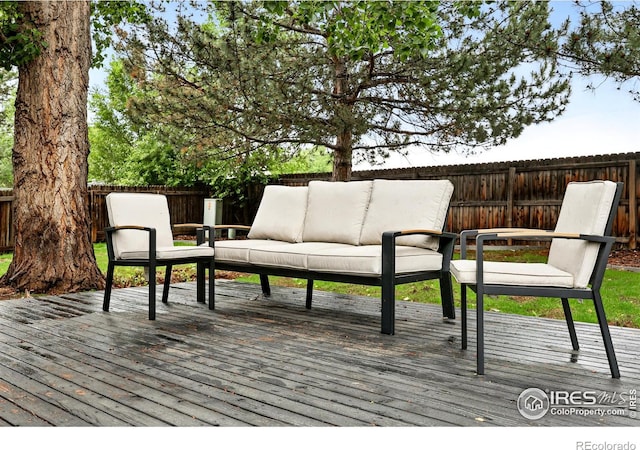 608 Bluegrass Dr, Longmont, CO 80503 - wooden terrace with an outdoor hangout area and a fenced backyard