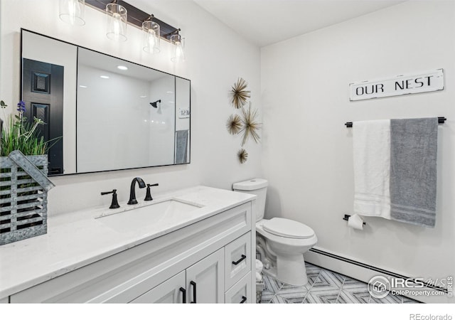 bathroom featuring a shower, vanity, toilet, and a baseboard heating unit