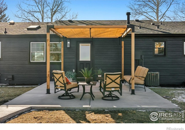 rear view of house with a patio and central AC unit