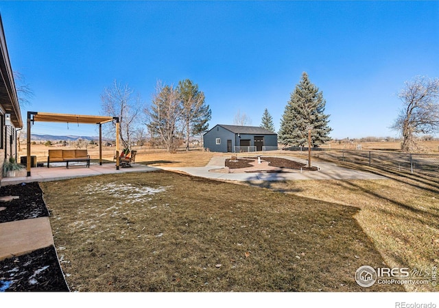 view of yard featuring a patio, a rural view, and an outdoor hangout area