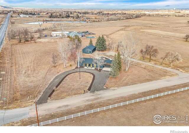 birds eye view of property with a rural view