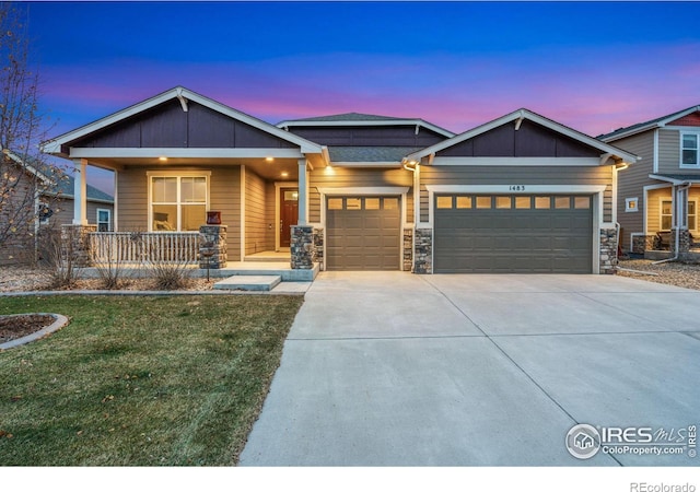 craftsman-style home featuring a porch and a garage