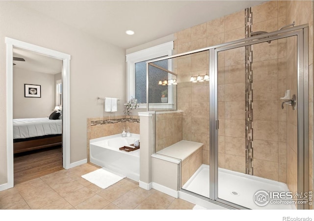 bathroom with tile patterned flooring and independent shower and bath