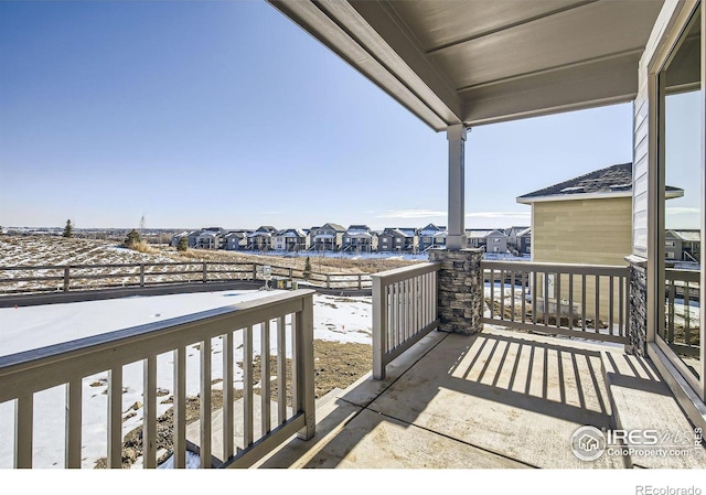 view of patio / terrace with a balcony and a residential view