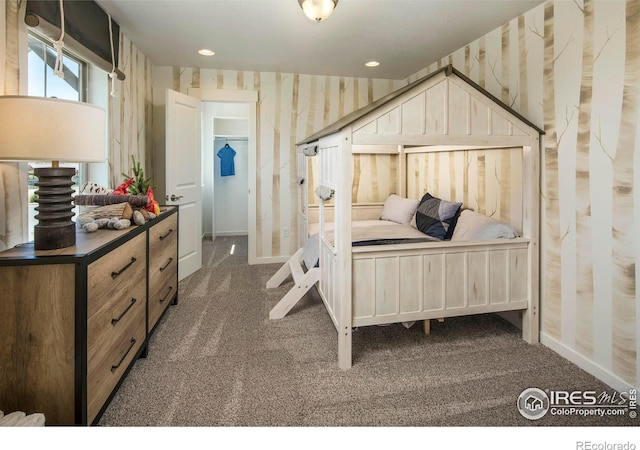 bedroom featuring dark colored carpet