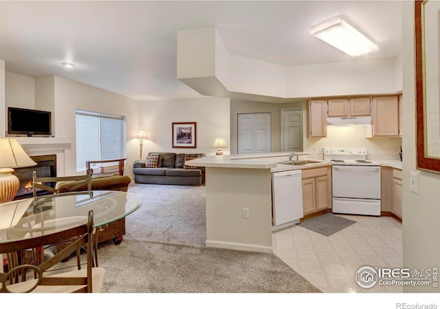 kitchen with kitchen peninsula, light carpet, light brown cabinets, and white appliances