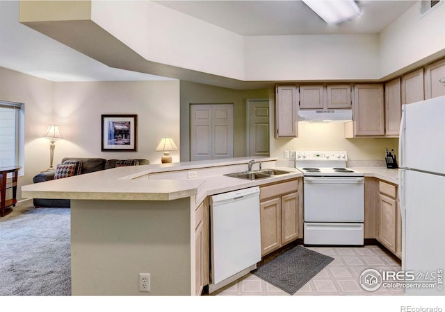 kitchen with sink, kitchen peninsula, white appliances, light carpet, and light brown cabinetry