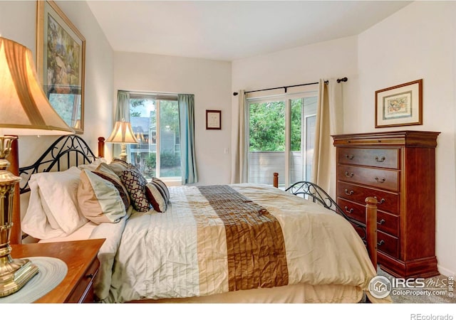 bedroom featuring access to outside and multiple windows