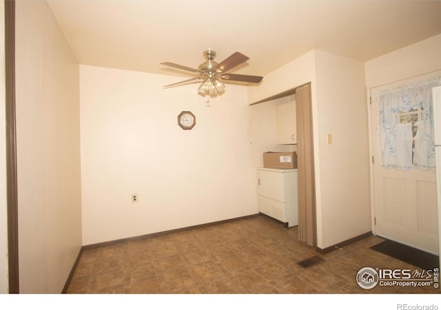 spare room with ceiling fan and washer / clothes dryer