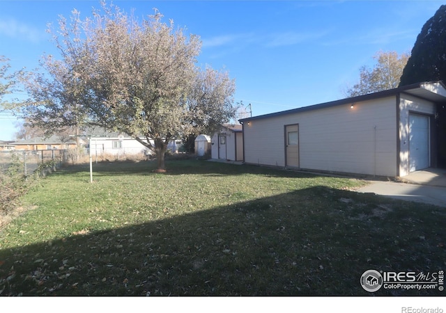 view of yard featuring a garage