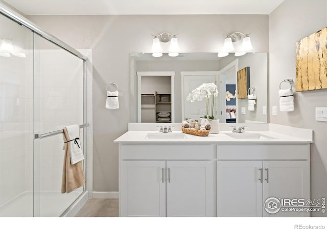 bathroom featuring vanity and walk in shower