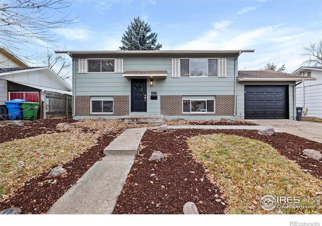 raised ranch featuring a garage