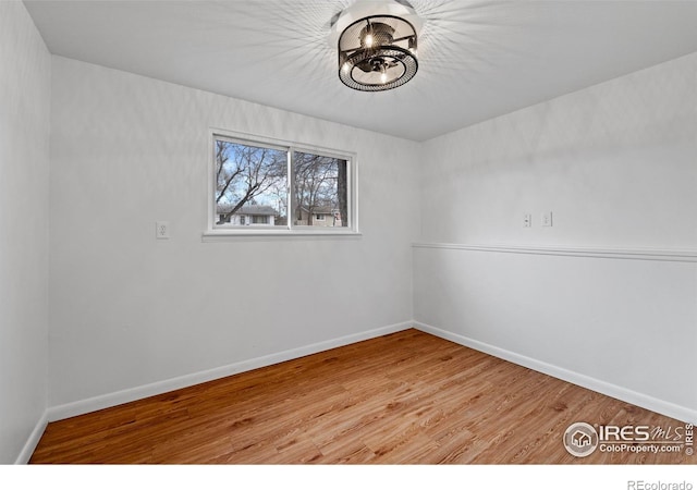 empty room with light hardwood / wood-style flooring