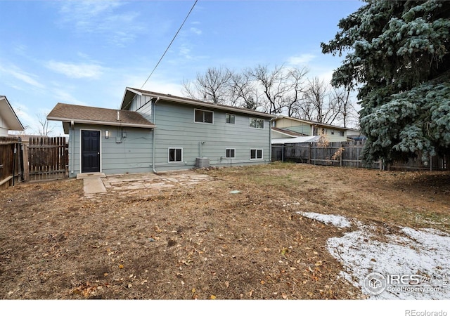 back of house featuring central AC