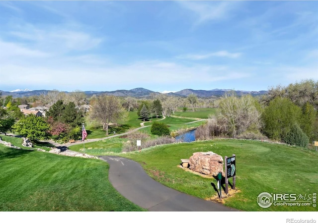 835 Rossum Dr, Loveland, CO 80537 - view of property's community featuring a yard and a water and mountain view